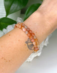 ARUSHA SUNSTONE 6mm - HANDMADE CRYSTAL BRACELET - 6mm, Arusha sunstone, bracelet, career, crystal bracelet, fire, handmade bracelet, jewelry, Leo, libra, orange, summer solstice, summerween collection, sunstone, Tanzanian sunstone, Wearable - The Mineral Maven