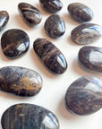 BLACK MOONSTONE PEBBLE - 2025 vibes, Black Friday sale, black moonstone, bulk, creativity, fertility, grounding, moonstone, new beginnings, new beginnings gift bundle, palm stone, pebble, pebbles, pocket crystal, protection, protection gift bundle, solar eclipse, spring equinox, spring things, taurus, taurus season, tumble - The Mineral Maven