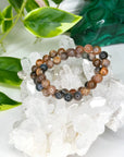 BLACK SUNSTONE 8mm - HANDMADE CRYSTAL BRACELET - 10 Dec Inventory, 8mm, abundance gift bundle, black sunstone, bracelet, bracelet inventory check, career, crystal bracelet, fire, Friday the 13th, handmade bracelet, jewelry, joy gift bundle, June 2025 inventory check, Leo, Leo szn, libra, market bracelet, orange, solar eclipse, sunstone, Wearable - The Mineral Maven