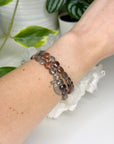 BLACK SUNSTONE (FACETED COIN) 8mm - HANDMADE CRYSTAL BRACELET - 10 Dec Inventory, 8mm, black sunstone, bracelet, career, crystal bracelet, faceted, faceted coin, fire, handmade bracelet, jewelry, June 2025 inventory check, Leo, Leo szn, libra, market bracelet, memento mori, memento mori collection, orange, sunstone, Wearable - The Mineral Maven