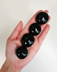 BLACK TOURMALINE PEBBLE - 2025 vibes, Black Friday sale, black tourmaline, crystals for beginners, emotional support, palm stone, palmstone, pebble, pebbles, pocket crystal, pocket stone, protection gift bundle, spring equinox, tourmaline, tucson update - The Mineral Maven