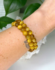 BLONDE TIGER’S EYE 8mm - HANDMADE CRYSTAL BRACELET - 8mm, blonde tigers eye, bracelet, capricorn, career, crystal bracelet, crystals for beginners, earth, fire, handmade bracelet, jewelry, Leo, market bracelet, summerween collection, sun, tiger’s eye, Wearable - The Mineral Maven