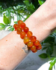CARNELIAN 10mm - HANDMADE CRYSTAL BRACELET - 10 Dec Inventory, 10mm, april astro, aries, aries stack, bracelet, bracelet inventory check, cancer, cancer stack, career, carnelian, crystal bracelet, crystals for beginners, emotional support, fertility, fire, handmade bracelet, jewelry, June 2025 inventory check, leo, leo stack, Leo szn, market bracelet, may day/beltane, Orange, red, spring things, summer solstice, taurus, taurus stack, virgo, virgo stack, Wearable - The Mineral Maven