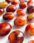 CARNELIAN PALM STONE - Black Friday sale, career, carnelian, crystals for beginners, emotional support, fertility, gallet, leo season, Leo szn, palm, palm stone, palmstone, spring equinox, spring things - The Mineral Maven