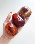 CARNELIAN PALM STONE - Black Friday sale, career, carnelian, crystals for beginners, emotional support, fertility, gallet, leo season, Leo szn, palm, palm stone, palmstone, spring equinox, spring things - The Mineral Maven