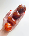 CARNELIAN PALM STONE - Black Friday sale, career, carnelian, crystals for beginners, emotional support, fertility, gallet, leo season, Leo szn, palm, palm stone, palmstone, spring equinox, spring things - The Mineral Maven
