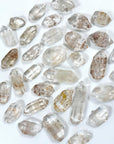 CLEAR QUARTZ POINT TUMBLE - Black Friday sale, clear quartz, crystals for beginners, pocket crystal, pocket crystals, pocket stone, quartz, tumble, tumbled, tumbled stone, tumbles, winter solstice - The Mineral Maven