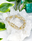 GOLDEN RUTILATED QUARTZ 6mm - HANDMADE CRYSTAL BRACELET - 10 Dec Inventory, 6mm, bracelet, bracelet inventory check, clear/white, crystal bracelet, emotional support, fall-o-ween, fall-o-ween bracelets, focus gift bundle, gemini, gemini stack, golden rutilated, golden rutilated quartz, handmade bracelet, jewelry, June 2025 inventory check, leo, leo stack, market bracelet, metallic, rutilated quartz, storm, Wearable, yellow - The Mineral Maven