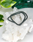 HEMATITE 4mm - HANDMADE CRYSTAL BRACELET - 10 Dec Inventory, 4mm, Aquarius, aries, bracelet, bracelet inventory check, crystal bracelet, earth, focus gift bundle, grey, handmade bracelet, hematite, jewelry, June 2025 inventory check, market bracelet, metallic, Scorpio Season, solstice collection, Wearable, winter solstice collection - The Mineral Maven