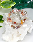 MOZAMBIQUE AGATE (FACETED) 8mm - HANDMADE CRYSTAL BRACELET - 10 Dec Inventory, 8mm, agate, bracelet, bracelet inventory check, crystal bracelet, emotional support, faceted, fire, gemini, gemini stack, handmade bracelet, jewelry, June 2025 inventory check, market bracelet, mixed colors, mozambique agate, solstice collection, Wearable, winter solstice collection - The Mineral Maven