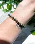 PYRITE 6mm - HANDMADE CRYSTAL BRACELET - 6mm, aries, bracelet, career, crystal bracelet, crystals for beginners, earth, fire, good luck + abundance, handmade bracelet, jewelry, June 2025 inventory check, leo, Leo szn, market bracelet, metallic, pyrite, Wearable - The Mineral Maven