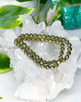 PYRITE (FACETED) 6mm - HANDMADE CRYSTAL BRACELET - 6mm, aries, bracelet, career, crystal bracelet, crystals for beginners, earth, faceted, fire, good luck + abundance, handmade bracelet, jewelry, June 2025 inventory check, leo, Leo szn, market bracelet, metallic, pyrite, Wearable - The Mineral Maven