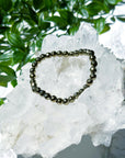 PYRITE (FACETED) 6mm - HANDMADE CRYSTAL BRACELET - 6mm, aries, bracelet, career, crystal bracelet, crystals for beginners, earth, faceted, fire, good luck + abundance, handmade bracelet, jewelry, June 2025 inventory check, leo, Leo szn, market bracelet, metallic, pyrite, Wearable - The Mineral Maven