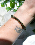 PYRITE (FACETED) 6mm - HANDMADE CRYSTAL BRACELET - 6mm, aries, bracelet, career, crystal bracelet, crystals for beginners, earth, faceted, fire, good luck + abundance, handmade bracelet, jewelry, June 2025 inventory check, leo, Leo szn, market bracelet, metallic, pyrite, Wearable - The Mineral Maven
