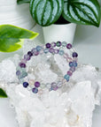 RAINBOW FLUORITE 6mm - HANDMADE CRYSTAL BRACELET - 6mm, august 2025 restock, bracelet, capricorn, crystal bracelet, crystals for beginners, fluorite, green, handmade bracelet, jewelry, libra, market bracelet, mercury rx, pisces, purple, Wearable - The Mineral Maven