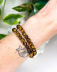 TIGER’S EYE 6mm - HANDMADE CRYSTAL BRACELET - 6mm, august 2025 restock, bracelet, capricorn, career, crystal bracelet, crystals for beginners, earth, fire, handmade bracelet, jewelry, June 2025 inventory check, Leo, Leo szn, market bracelet, sun, tiger’s eye, Wearable - The Mineral Maven