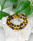 TIGER’S EYE 8mm - HANDMADE CRYSTAL BRACELET - 8mm, bracelet, capricorn, career, crystal bracelet, crystals for beginners, earth, fire, handmade bracelet, jewelry, Leo, market bracelet, summerween collection, sun, tiger’s eye, Wearable - The Mineral Maven