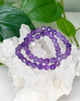 AMETHYST (FACETED) 8mm - HANDMADE CRYSTAL BRACELET - 6th anniversary, 8mm, air, amethyst, aquarius, aries, aries stack, bracelet, crystal bracelet, crystals for beginners, emotional support, faceted, handmade bracelet, jewelry, libra, mercury retrograde, mercury rx, pisces, purple, sagittarius, scorpio, Scorpio Season, storm, virgo, water, Wearable - The Mineral Maven