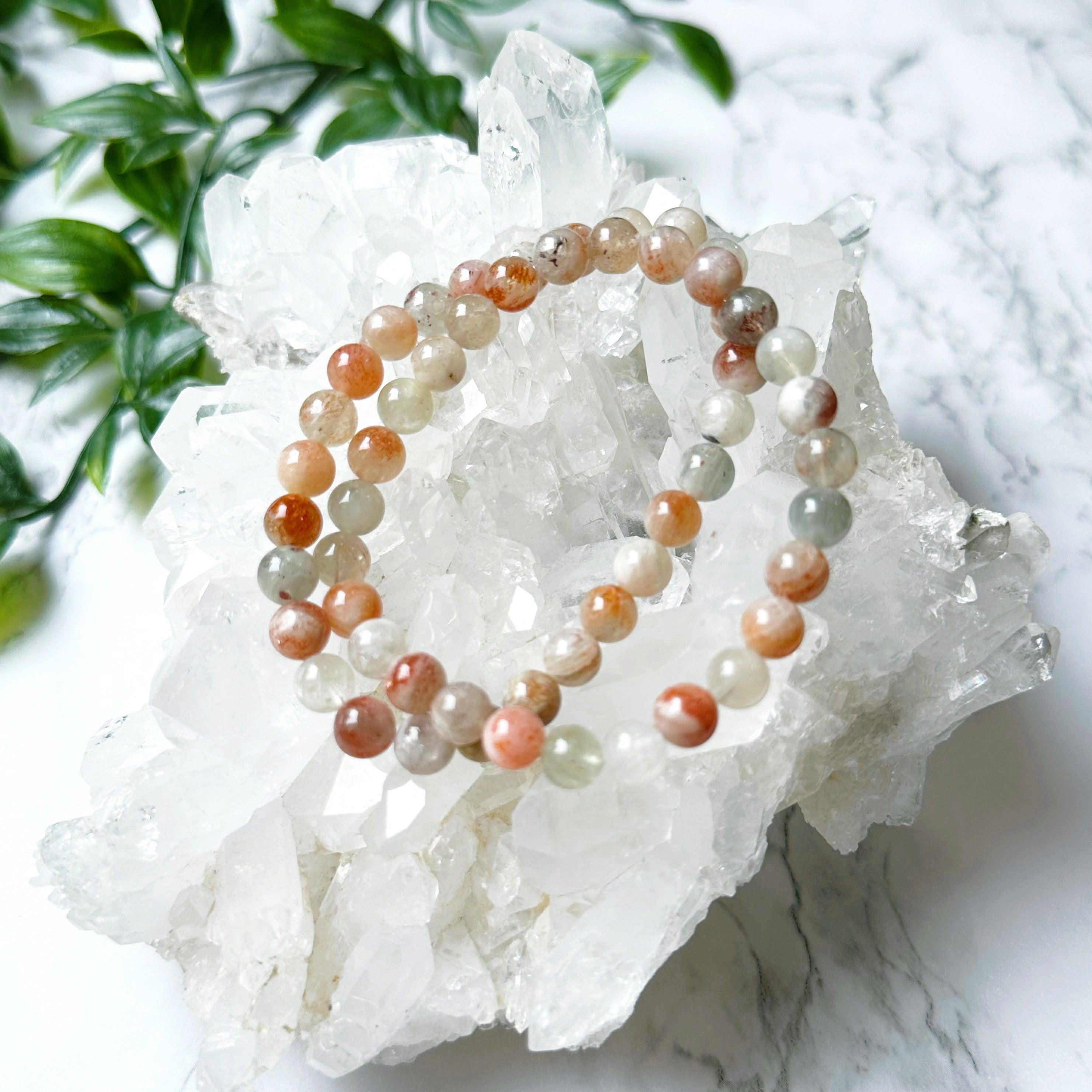 ARUSHA SUNSTONE MOONSTONE 7mm - HANDMADE CRYSTAL BRACELET - 7mm, abundance gift bundle, Arusha sunstone, bracelet, career, crystal bracelet, fertility, fire, grey, handmade bracelet, jewelry, joy gift bundle, june wrist candy, Leo, leo stack, libra, libra stack, market bracelet, new beginnings gift bundle, orange, recently added, restocked, solar eclipse, summer solstice, summer wrist candy, sunstone, Tanzanian sunstone, Wearable - The Mineral Maven