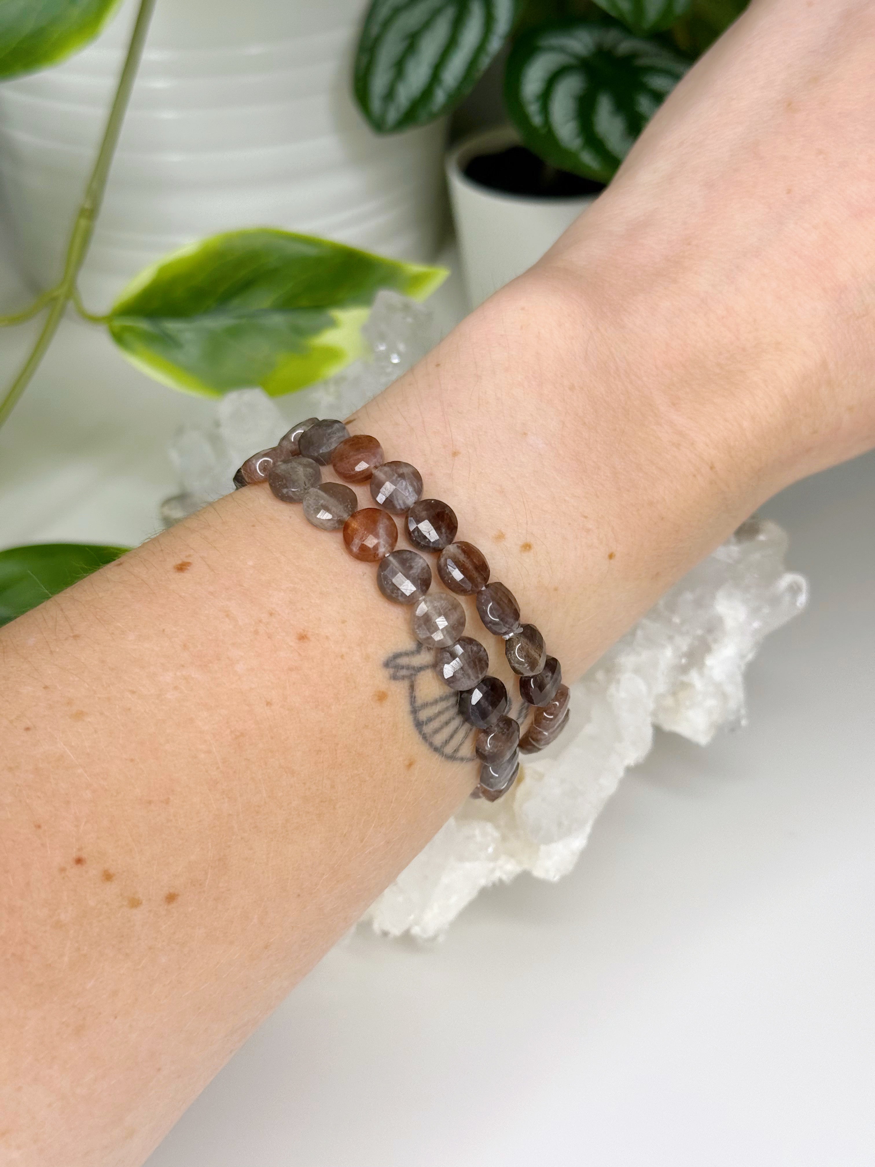 BLACK SUNSTONE (FACETED COIN) 8mm - HANDMADE CRYSTAL BRACELET - 10 Dec Inventory, 8mm, black sunstone, bracelet, career, crystal bracelet, faceted, faceted coin, fire, handmade bracelet, jewelry, June 2025 inventory check, Leo, Leo szn, libra, market bracelet, memento mori, memento mori collection, orange, sunstone, Wearable - The Mineral Maven