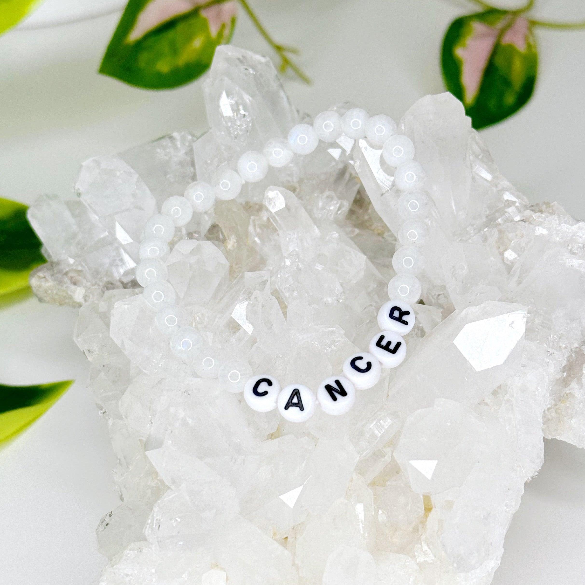 &#39;CANCER&#39; MOONSTONE 6mm - HANDMADE CRYSTAL BRACELET - 6mm, air, astro collection, bracelet, cancer, cancer season, cancer stack, clear/white, crystal bracelet, fertility, handmade bracelet, jewelry, moonstone, recently added, water, Wearable, white - The Mineral Maven