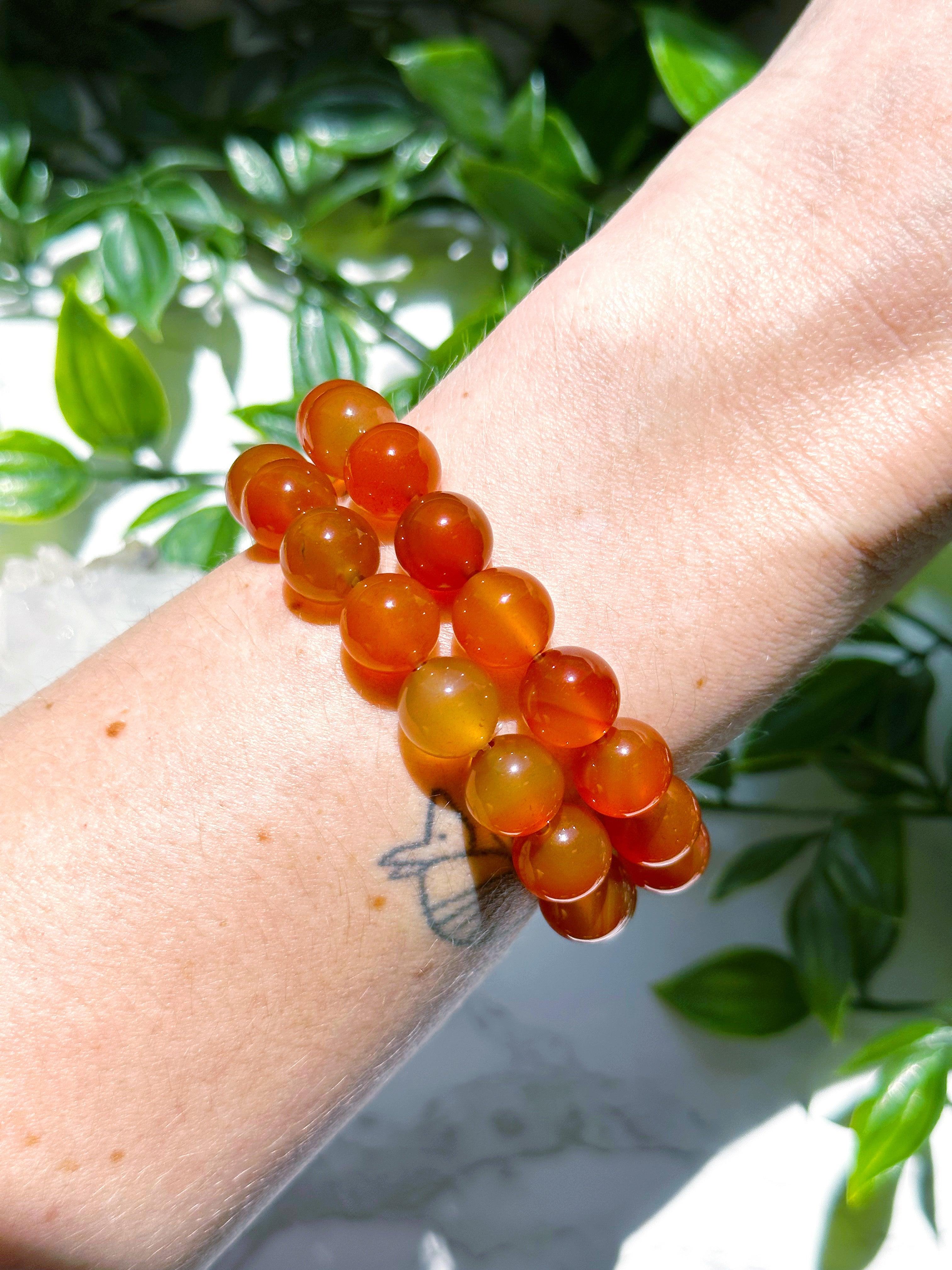 CARNELIAN 10mm - HANDMADE CRYSTAL BRACELET - 10mm, april astro, aries, aries stack, bracelet, cancer, cancer stack, career, carnelian, crystal bracelet, emotional support, fertility, fire, handmade bracelet, jewelry, leo, leo stack, market bracelet, may day/beltane, Orange, recently added, red, summer solstice, taurus, taurus stack, virgo, virgo stack, Wearable - The Mineral Maven