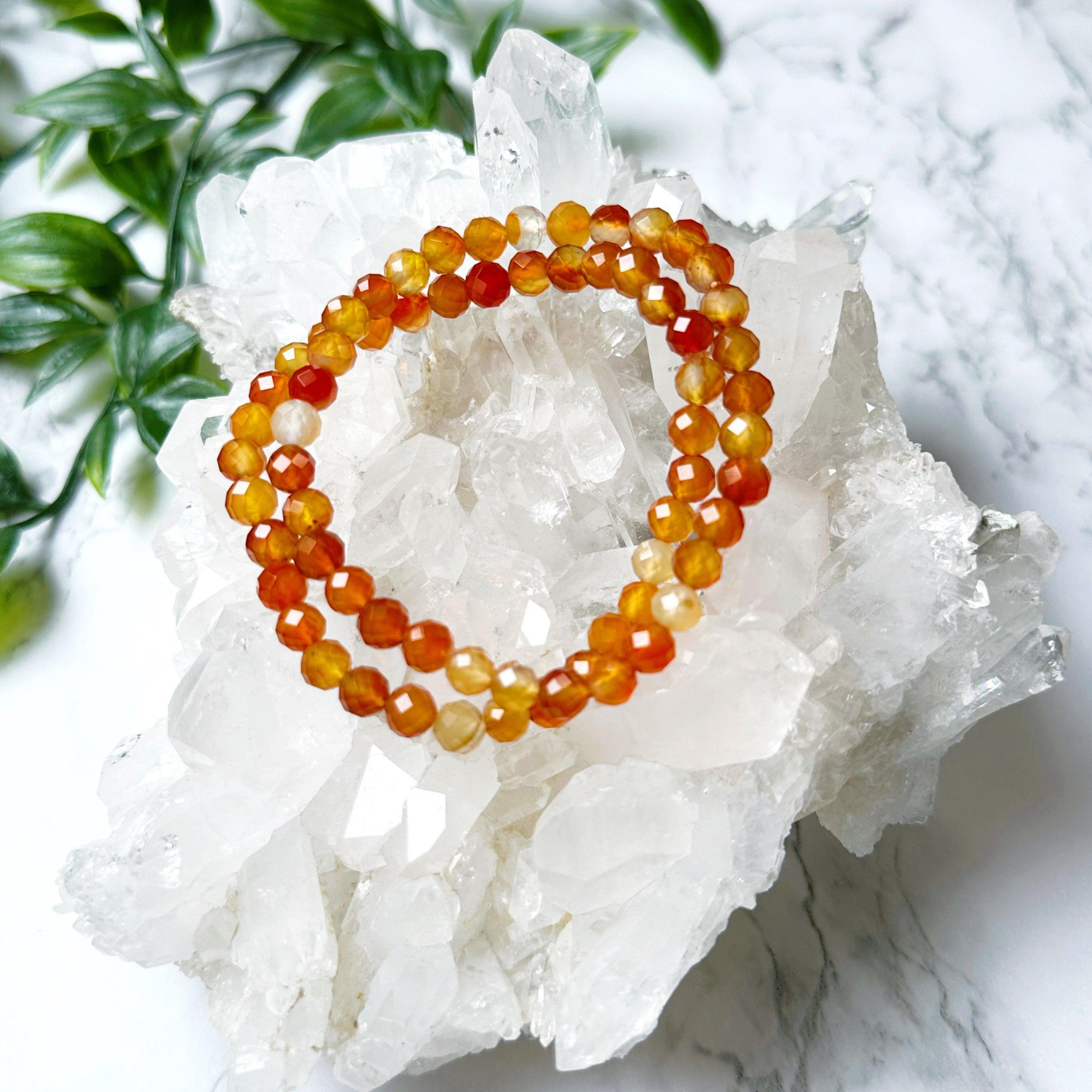 CARNELIAN (FACETED) 6mm - HANDMADE CRYSTAL BRACELET - 10 Dec Inventory, 6mm, bracelet, bracelet inventory check, cancer, cancer stack, career, carnelian, crystal bracelet, crystals for beginners, emotional support, faceted, fertility, fire, handmade bracelet, jewelry, June 2025 inventory check, june wrist candy, Leo, leo stack, Leo szn, market bracelet, orange, red, spring things, summer solstice, summer wrist candy, taurus, taurus stack, virgo, virgo stack, Wearable - The Mineral Maven