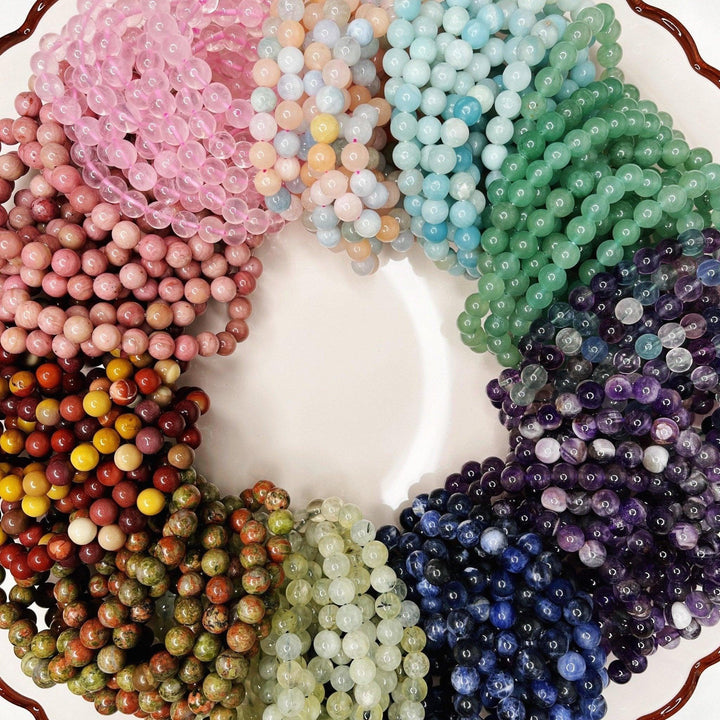 CRYSTAL BRACELETS - amazonite, black obsidian, bracelet, bracelets, dalmatian jasper, energy tool, flash sale, fluorite, garden quartz, garnet, gold sheen obsidian, green, green aventurine, holiday sale, howlite, jewelry, labradorite, lodalite, lodolite, mookaite, morganite, new year sale, prehnite, quartz, rainbow fluorite, rhodonite, rose quartz, snowflake obsidian, sodalite, spring equinox, sunstone, tigers eye, tourmalinated quartz, tourmaline, unakite, wearable - The Mineral Maven