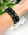GOLD SHEEN OBSIDIAN 14mm - HANDMADE CRYSTAL BRACELET - 10 Dec Inventory, 14mm, black, bracelet, bracelet inventory check, crystal bracelet, Friday the 13th, gold sheen obsidian, handmade bracelet, jewelry, June 2025 inventory check, market bracelet, obsidian, scorpio, scorpio stack, virgo, virgo stack, Wearable - The Mineral Maven
