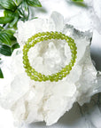 PERIDOT (FACETED) 5mm - HANDMADE CRYSTAL BRACELET - 5mm, abundance gift bundle, bracelet, crystal bracelet, earth, faceted, green, handmade bracelet, jewelry, joy gift bundle, leo, leo stack, market bracelet, mini, mini update, peridot, recently added, springtime, transform gift bundle, vernal vibes, Wearable - The Mineral Maven