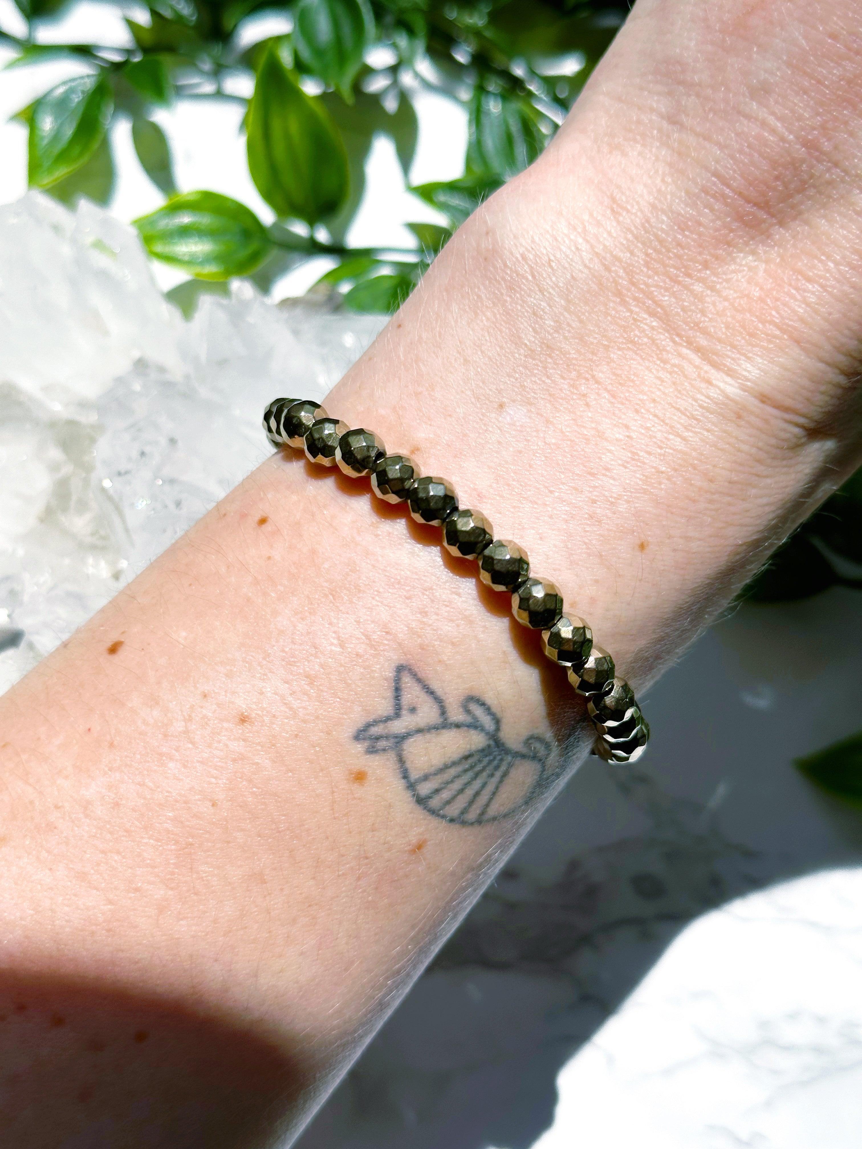 PYRITE (FACETED) 6mm - HANDMADE CRYSTAL BRACELET - 6mm, aries, bracelet, career, crystal bracelet, crystals for beginners, earth, faceted, fire, good luck + abundance, handmade bracelet, jewelry, June 2025 inventory check, leo, Leo szn, market bracelet, metallic, pyrite, Wearable - The Mineral Maven