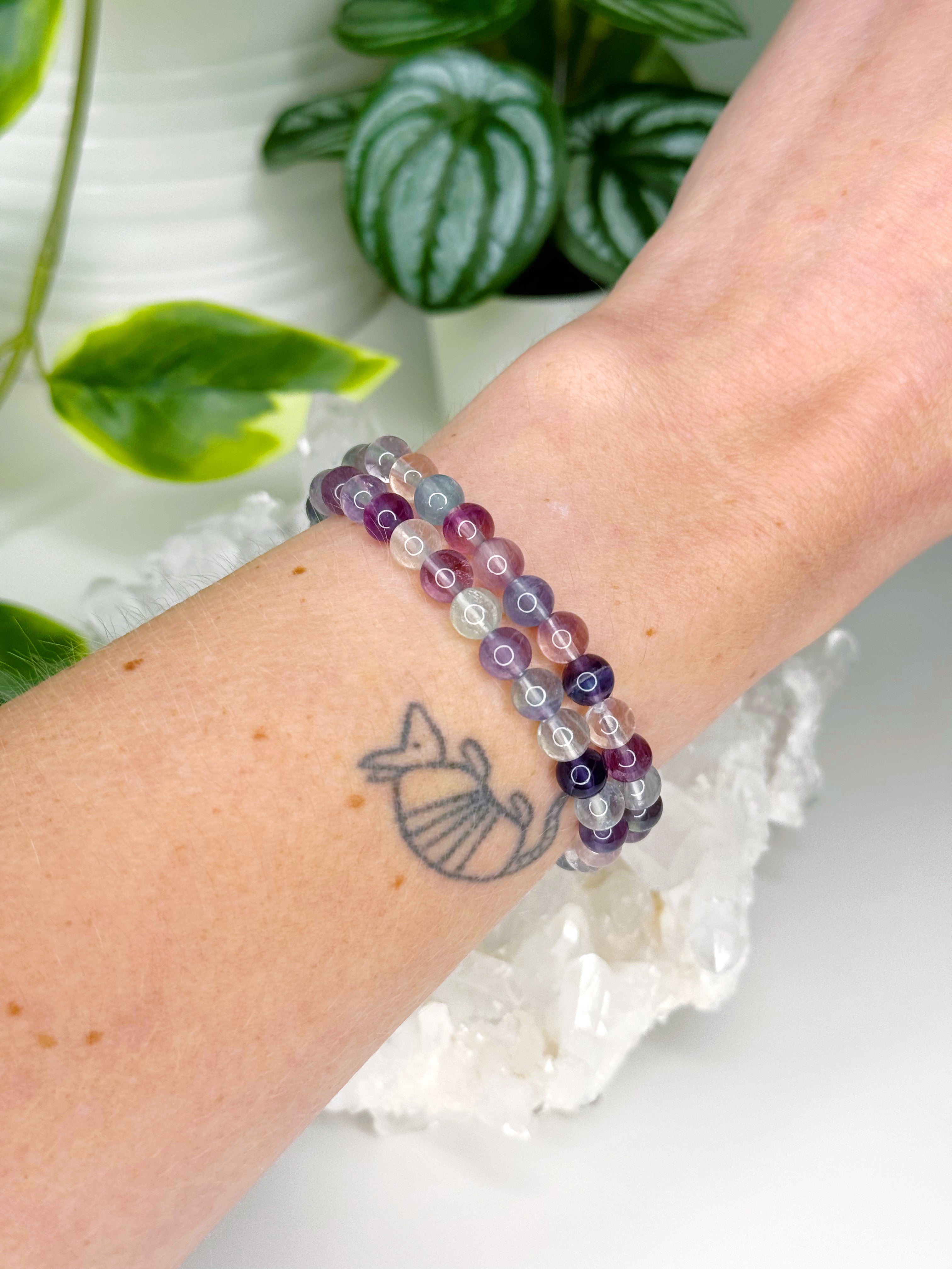RAINBOW FLUORITE 6mm - HANDMADE CRYSTAL BRACELET - 6mm, august 2025 restock, bracelet, capricorn, crystal bracelet, crystals for beginners, fluorite, green, handmade bracelet, jewelry, libra, market bracelet, mercury rx, pisces, purple, Wearable - The Mineral Maven