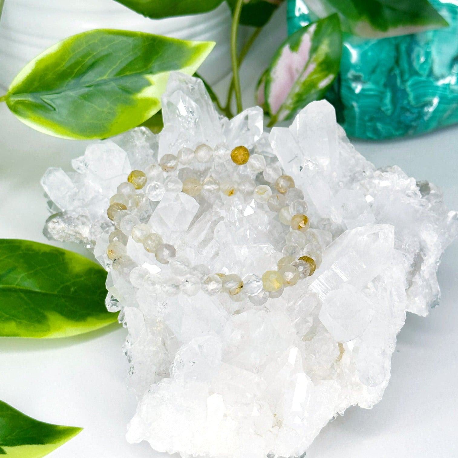 RUTILATED QUARTZ (FACETED) 6mm - HANDMADE CRYSTAL BRACELET - 10 Dec Inventory, 6mm, bracelet, bracelet inventory check, clear/white, crystal bracelet, emotional support, faceted, fall-o-ween, fall-o-ween bracelets, focus gift bundle, gemini, gemini stack, handmade bracelet, jewelry, June 2025 inventory check, leo, leo stack, market bracelet, metallic, rutilated quartz, storm, Wearable, yellow - The Mineral Maven