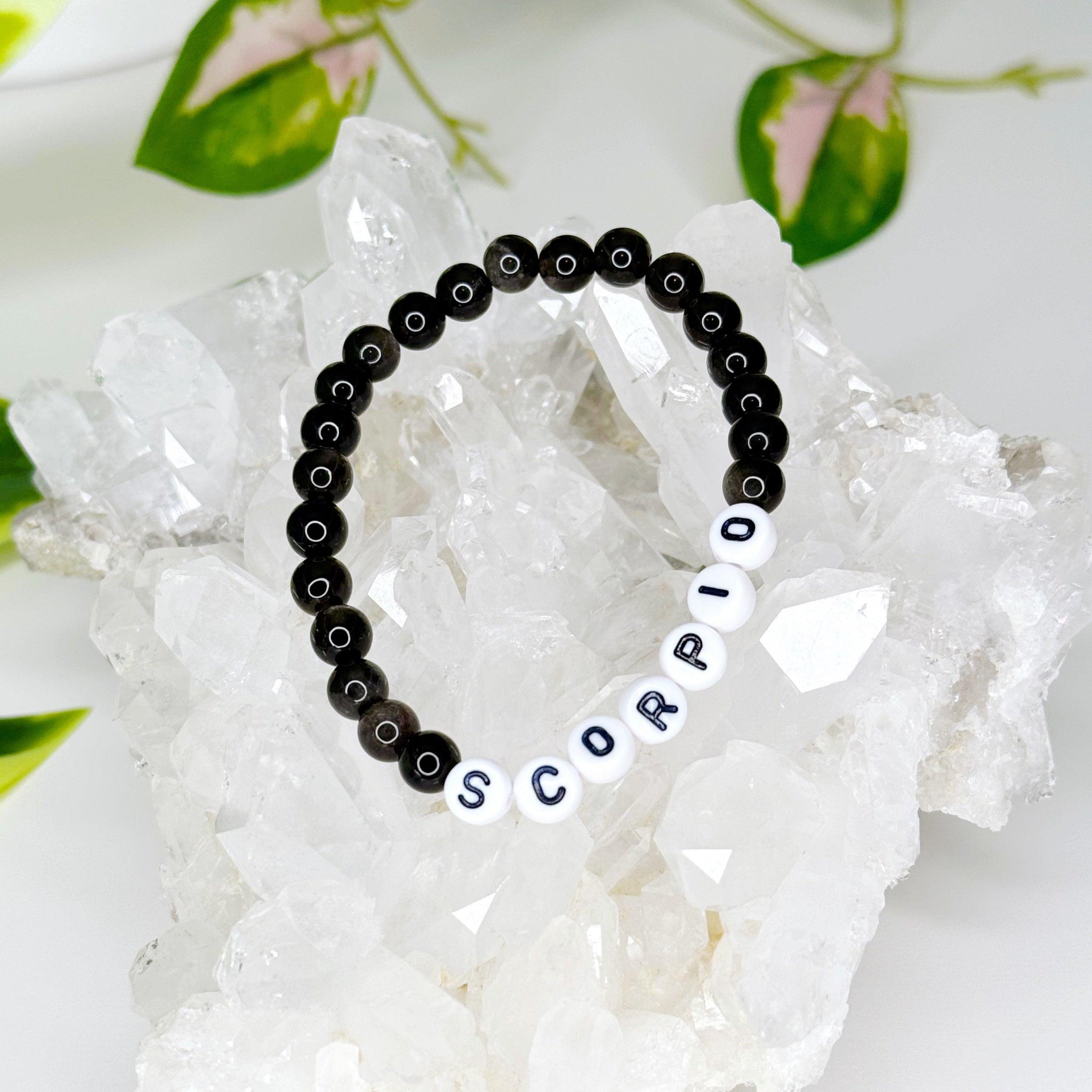 'SCORPIO' SILVER SHEEN OBSIDIAN 6mm - HANDMADE CRYSTAL BRACELET - 10 Dec Inventory, 6mm, astro collection, black, bracelet, bracelet inventory check, crystal bracelet, handmade bracelet, jewelry, June 2025 inventory check, obsidian, scorpio, Scorpio Season, scorpio stack, silver sheen obsidian, water, Wearable - The Mineral Maven