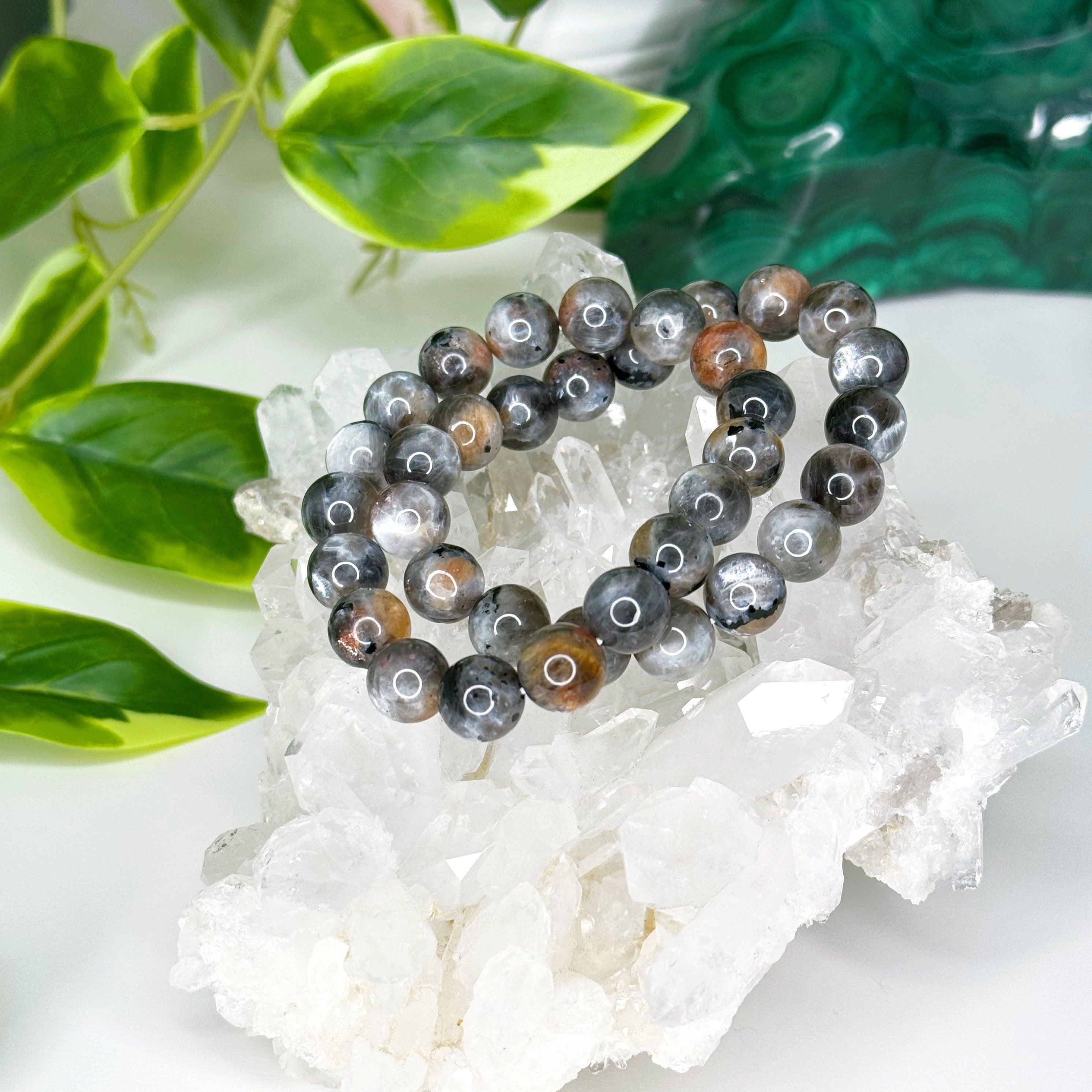 SUNSTONE MOONSTONE (SILVER FLASH) 10mm - HANDMADE CRYSTAL BRACELET - 10 Dec Inventory, 10mm, abundance gift bundle, bracelet, bracelet inventory check, career, crystal bracelet, fertility, fire, Friday the 13th, grey, handmade bracelet, jewelry, joy gift bundle, June 2025 inventory check, Leo, libra, market bracelet, moonstone, new beginnings, new beginnings gift bundle, orange, solar eclipse, sunstone, Wearable - The Mineral Maven